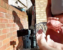 Foot job and cum on feet in the garden sunshine