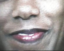 Superb black model licks pussy on the black bed